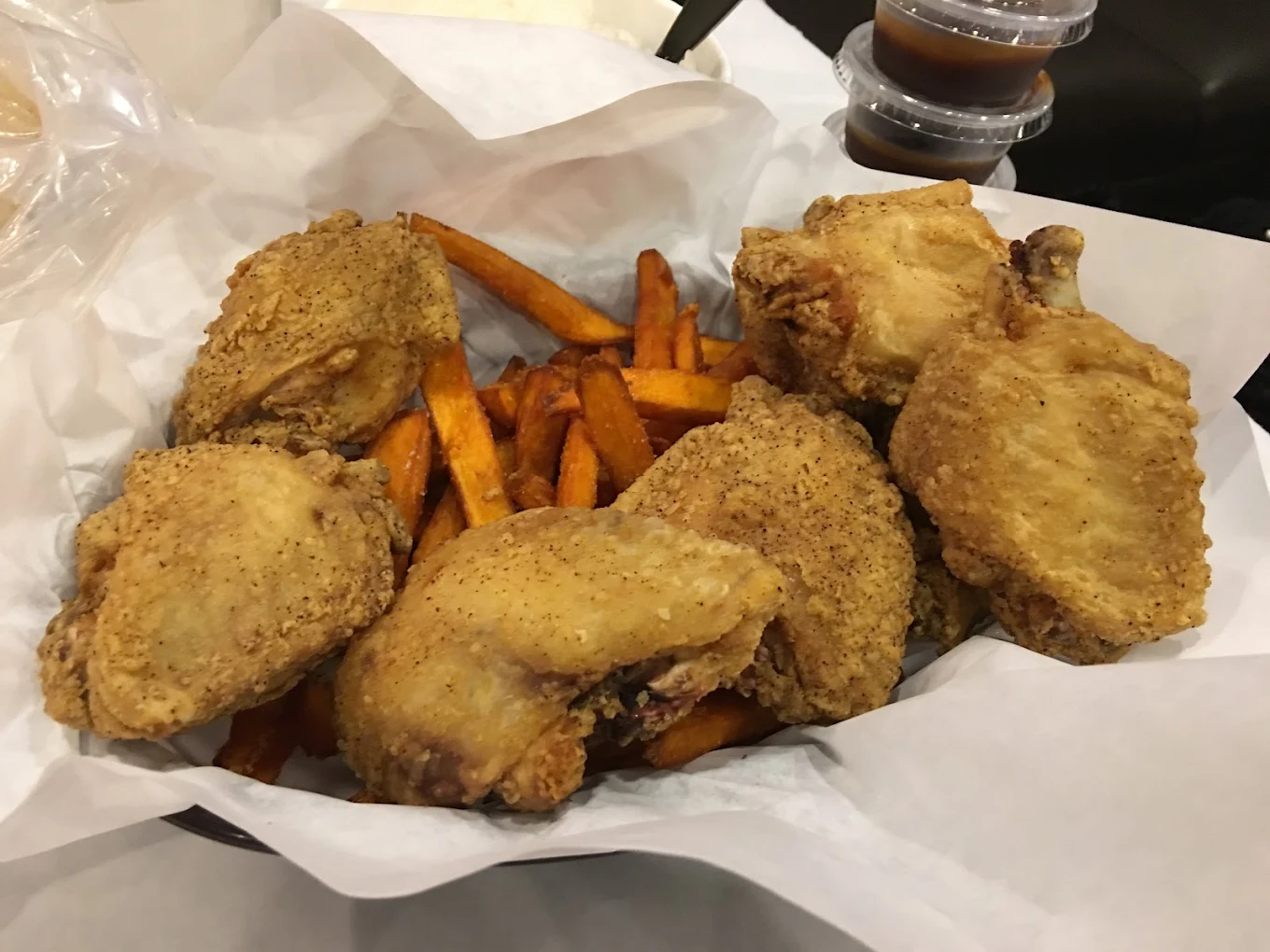 Crispy Catfish basket and Cajun Fries takeout from Captain Crawfish Coffee Road